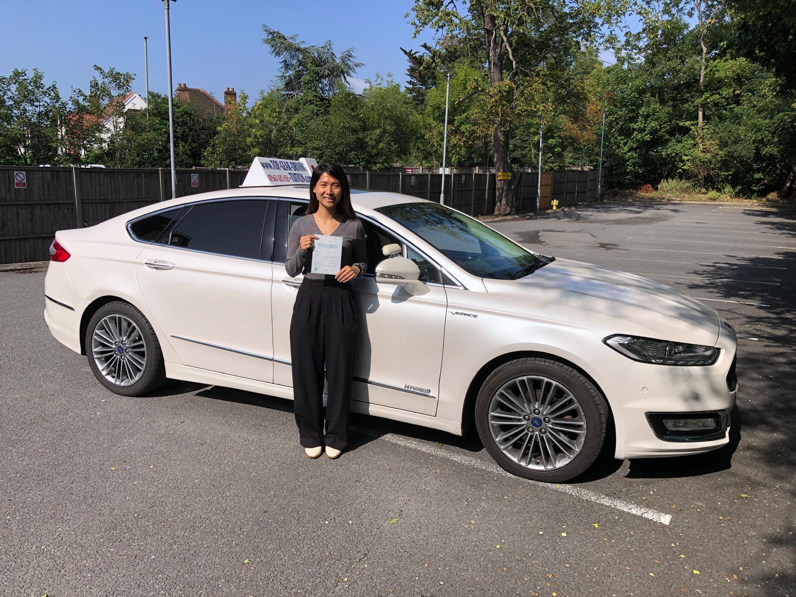 Student 9 celebrating passing their driving test with Top Gear Driving School